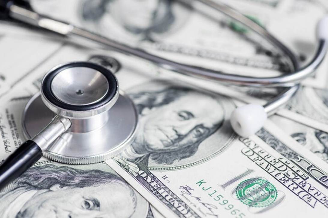 A stethoscope and a stethoscope on top of money

AI-generated content may be incorrect.